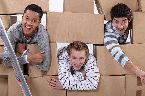 Professional moving truck loading furniture for a Welling relocation
