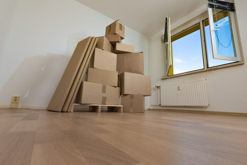 Packed office boxes and furniture ready for relocation