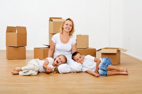Movers transporting office equipment during a Welling relocation