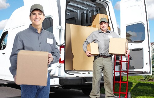 Packed office equipment and furniture ready for transport