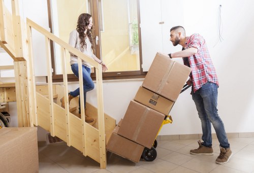 Preparing boxes and furniture for a Welling moving van