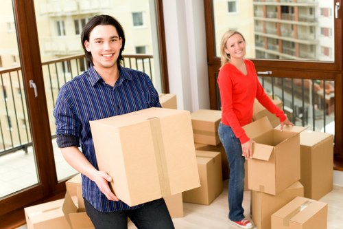 Local moving team loading furniture near Welling homes