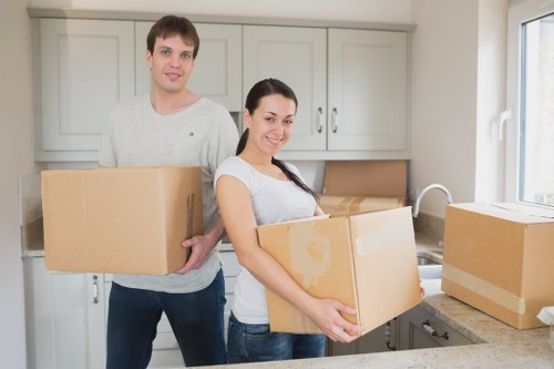 Professional mover handling boxes and furniture near Welling